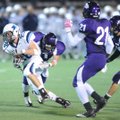 Springdale Har-Ber senior running back Gordon Welch, left, breaks a tackle before cutting upfield ag...