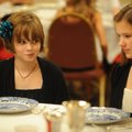 Miah Schultz, left, and Anna Gentry, both 11-year-olds from Fayetteville, puzzle over a place settin...