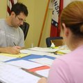 Herbert Harris, an election consultant from Central Arkansas, counts write-in votes Wednesday at the...