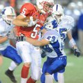 Fayetteville Ramay running back Aaron Kildow is tackled by Fayetteville Woodland defensive back Max ...