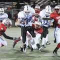 Fayetteville Woodland’s Tres Tucker splits the defense against Springdale George in the first half T...
