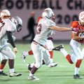  Fayetteville Ramay’s Tristan Stalbaum, right, sidesteps Siloam Springs freshman linebacker Reece Go...
