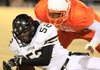 Jonesboro's Dillian Hill (52) and Hall High's LaMarcus Cole scramble for a loose ball Thursday night during their game in Little Rock.