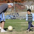  Jorge Becerra plays soccer with son Joshua Julian Becerra, 4, Thursday at Veterans Park in Rogers. ...