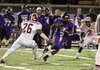 El Dorado's Wendall Thompson (9) splits the Pine Bluff defense after a catch from Taylor Reed. El Dorado (9-1, 6-0) defeated Pine Bluff (9-1, 6-1) 34 to 26, at Memorial Stadium in El Dorado on Thursday...