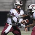  Springdale High’s Joseph Calcagni, left, hands the ball to K D Jones on Friday against Rogers High ...