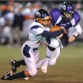  Fayetteville senior receiver Drew Gorton, right, comes down with the ball as Rogers Heritage sophom...