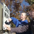  Kelsey Goodman, left, and Foster Albrecht clean road signs Friday at Horseshoe Bend park on Beaver ...