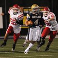  Shiloh Christian’s Garrett Harper outruns Farmington’s Austin Oslica, left, and Stephen Sanders on ...