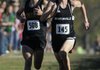 Bentonville’s Will Aenchbacher, right, springs ahead of Little Rock Central’s Jerry Melnyk at the end of the 7A state cross country championship race Saturday Nov. 6, 2010 at Rogers High School. Aenchbacher finished third with a time of 16:14.7 leading the Tigers to a first place team finish of 45 points. Visit http://photos.nwaonline.net/ to see more photos from the event.
