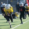 Evan Clark, 8, with the Commodores breaks to the outside while taking on the War Eagles at Tiger Sta...