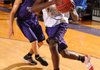 Fayetteville senior Jahree Fisher, center, drives past junior Kile Graves during the Purple-White scrimmage Nov. 2 at Fayetteville.
