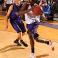Fayetteville senior Jahree Fisher, center, drives past junior Kile Graves during the Purple-White sc...