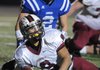 Springdale High’s Henry Hernandez looks to the official for the touchdown signal Friday after crossing the goal line while taking on the Mounties at Rogers High School.