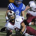 Springdale High’s Henry Hernandez looks to the official for the touchdown signal Friday after crossi...