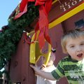 Christian Bartleson, 4, and his sister Caroline Bartleson, 2, play Monday on the holiday decorated c...