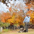 Claude Lower of Fayetteville mows between grave markers Tuesday at Son’s Chapel Cemetery in Fayettev...