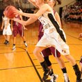Prairie Grove’s Kendra Coyle shoots a layup as Lincoln freshman forward Haley Summers reaches to
de...
