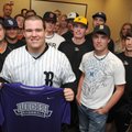 Bentonville baseball player Matt Russell is joined by friends, family and teammates Wednesday as he ...
