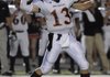 Rogers Heritage senior quarterback Reed Brown drops back to pass against Rogers High during the first half Oct. 1 in Mountie Stadium at Rogers.