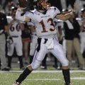 Rogers Heritage senior quarterback Reed Brown drops back to pass against Rogers High during the firs...