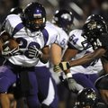 Fayetteville running back Brice Gahagans weaves through the Bentonville secondary during the Bulldog...