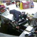 Police released this image taken from a security camera of a suspect taking cash from a register at ...