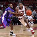 With sophomore Julysses Nobles (above right) and Jeff Peterson handling
point guard duties, Arkansa...