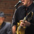 Award-winning cartoonist and author Jeff Koterba also plays guitar in a pop-swing band called the Pr...