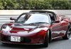 Akio Toyoda, president of Toyota Motor Corp., drives a new Tesla Motors roadster Friday in Tokyo. 