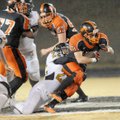 Gravette running back Darrick Strzelecki fights to break away from a Trumann defender Friday during ...
