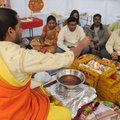 Hindu priest Venugopala Gattuji, left, leads members of the Hindu Association of Northwest Arkansas ...