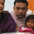 Sanjana, from right, 18 months, sits with her parents, Venkata and Sunitha Sai, during the Diwali ce...