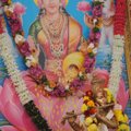 A depiction of Lakshmi, Hindu goddess of wealth and happiness, is wreathed with flowers for the Laks...
