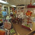 SEASONAL SHOPPING - Margaret Post walks across the showroom at Gift House Antiques on Wednesday. Pos...