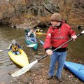 PADDLE PRE - Volunteer John Hodgin, right, shows Maddie, 10, of Lincoln, left, how to direct a kayak...