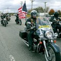 RIDE ON - Some of the more than 200 riders in a Veterans Day Parade arrive Saturday at Pig Trail Har...