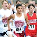 Springdale junior Jarvis Odems, left, scores as sophomore Jordan Johnson, right, defends during the ...