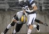 Springdale Har-Ber running back Tucker Lee is hit by Little Rock Central linebacker Larry Wilbourn after picking up a first down on Friday of their first-round game in the Class 7A State Playoffs in Jarrell Williams Bulldog Stadium in Springdale.