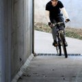Matt Jagnow cuts through the Northwest A Street tunnel Sunday on the North Bentonville Trail. Jagnow...