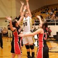 Bentonville guard Montana Lewis shoots over Pea Ridge defenders Tuesday in Tiger Arena in Bentonvill...