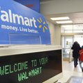 FILE - In this Feb. 17, 2009 file photo, shoppers leave a Wal-Mart in Danvers, Mass.