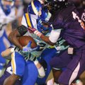 North Little Rock running back Altee Tenpenny, center, is tackled by Fayetteville senior cornerback ...