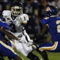 Conway’s Desmond Cox evades North Little Rock defenders during the Wampus Cats’ 38-6 win on Oct. 1 a...