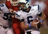 Springdale Har-Ber's Ryan Luther runs the ball as Cabot's Jared Dumais gives chase during their game Friday night in Cabot.