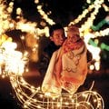 Jaime Fernandez of Springdale pauses with his daughter Fernanda, 1, against the backdrop of Christma...