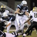  Springdale Har-Ber running back Gordon Welch jumps over the line on a carry on Nov. 12 during a fir...