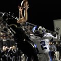  Bentonville receiver Austin Molitor catches a pass over Bryant defensive back Dillon Winfrey during...