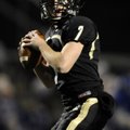 Bentonville quarterback Dallas Hardison drops back to pass during a Class 7A state playoff game on N...