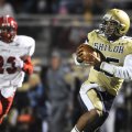 Shiloh Christian’s Kiehl Frazier catches a pass for a touchdown as McGehee’s Chase Garner gives chas...